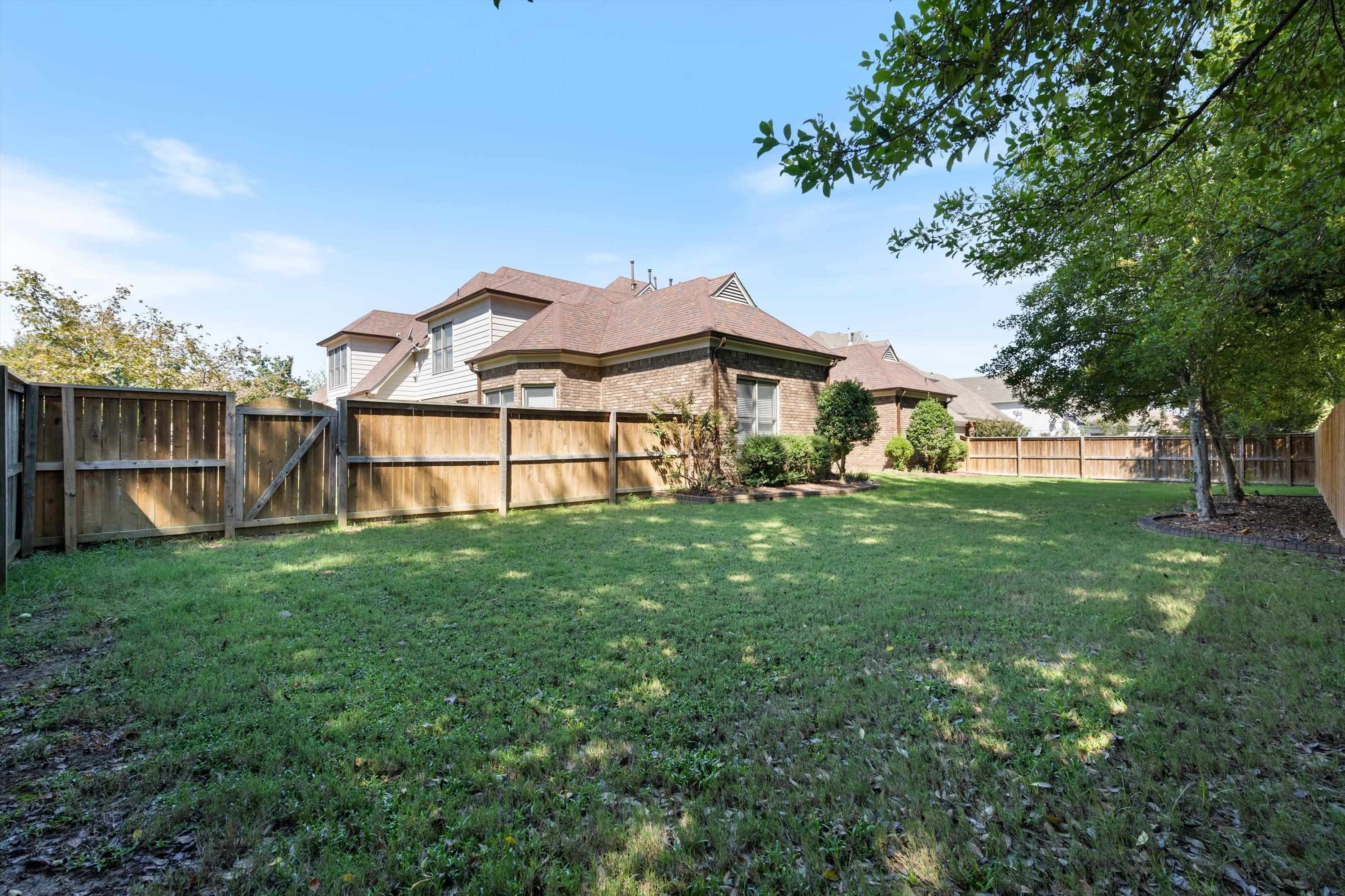 1710 Stillwind Lane Collierville, TN 38017 - Photo 36 of 40 Large, flat grassy backyard