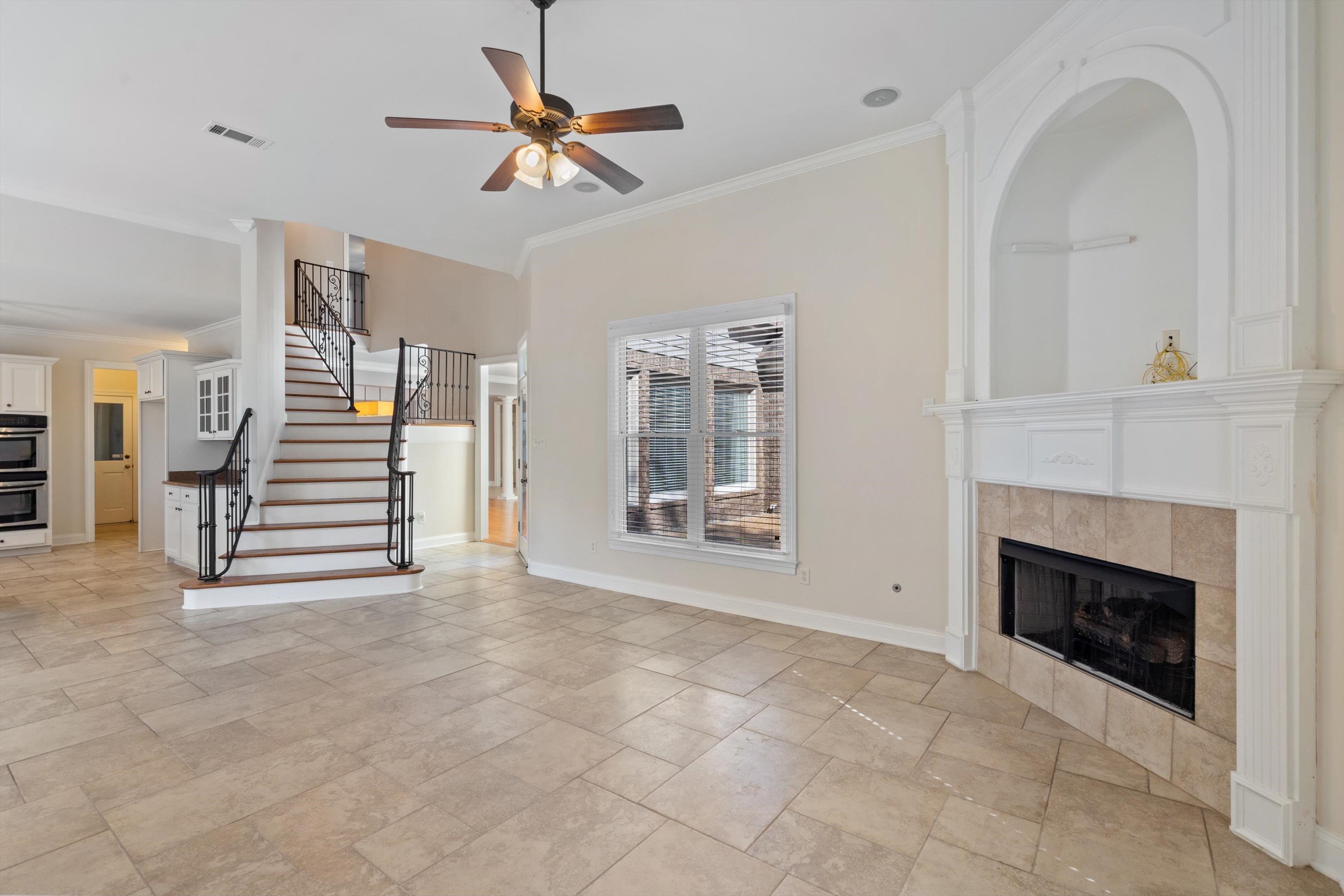 1710 Stillwind Lane Collierville, TN 38017 - Photo 8 of 40 Cozy hearth room with gas fireplace and stairs to second story