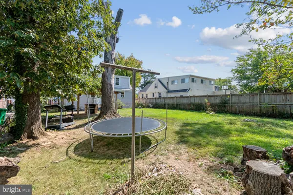 a swimming pool with some trees in the background
