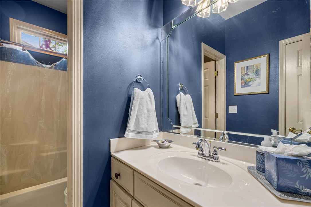 106 Red Maple Way Clemson, SC 29631 - Photo 17 of 49 A classic vanity setup coordinates beautifully with a tiled bathtub area nearby.