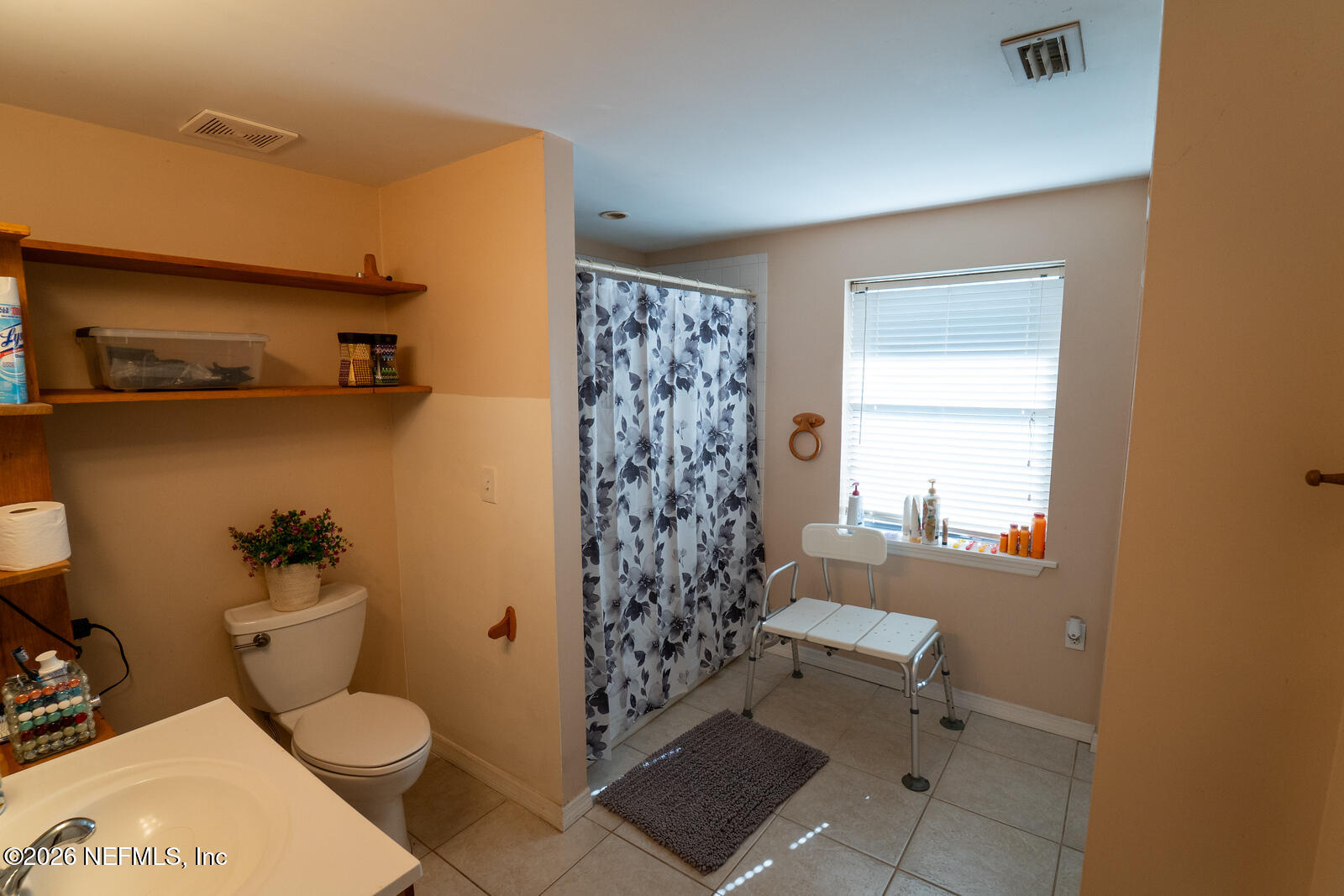 5308 North River Road Jacksonville, FL 32211 - Photo 14 of 25 a bathroom with a toilet and a shower