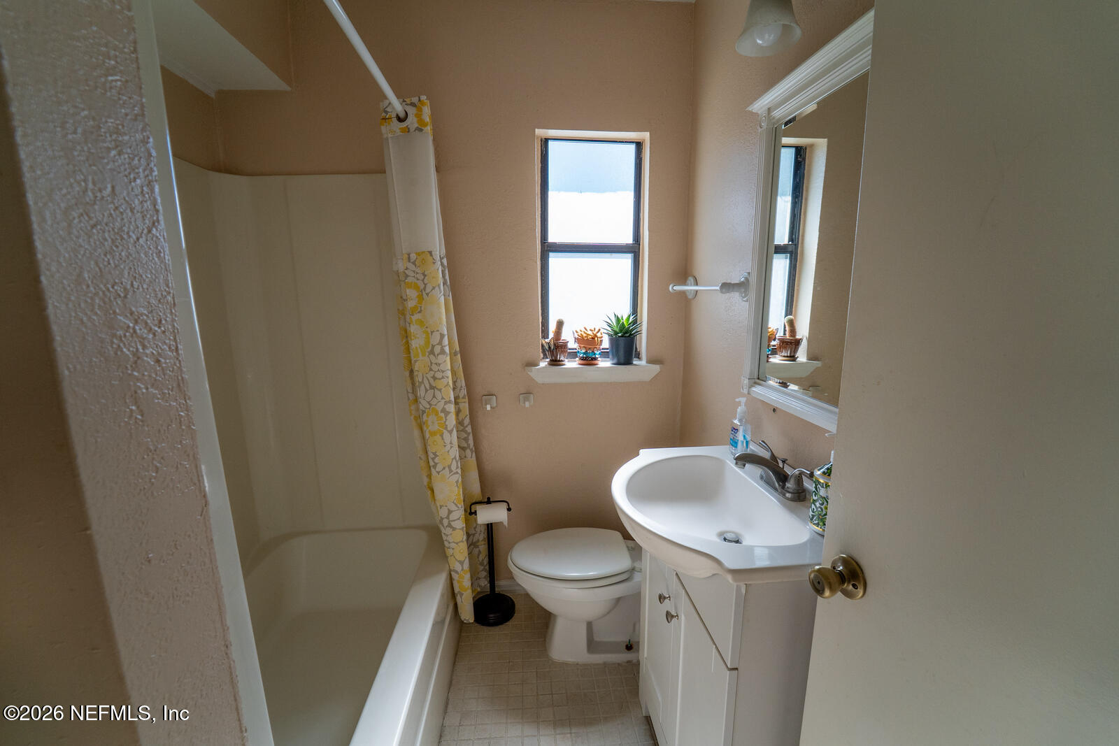 5308 North River Road Jacksonville, FL 32211 - Photo 22 of 25 a bathroom with a toilet sink and a mirror