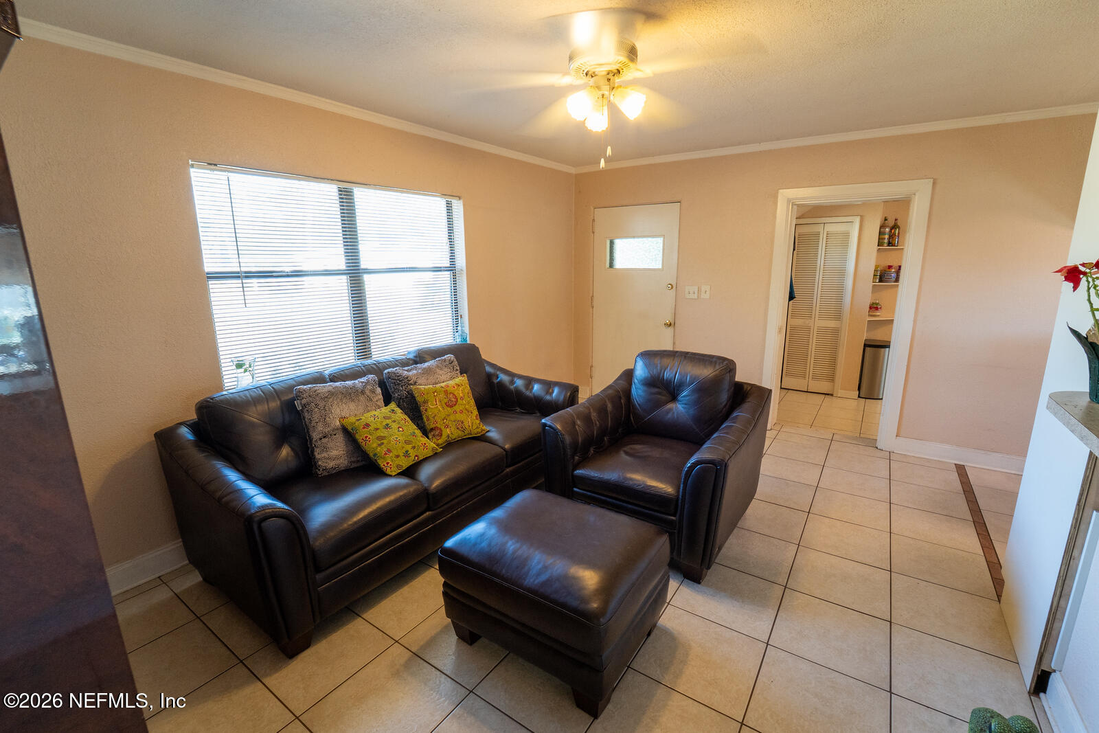 5308 North River Road Jacksonville, FL 32211 - Photo 4 of 25 a living room with furniture and a large window