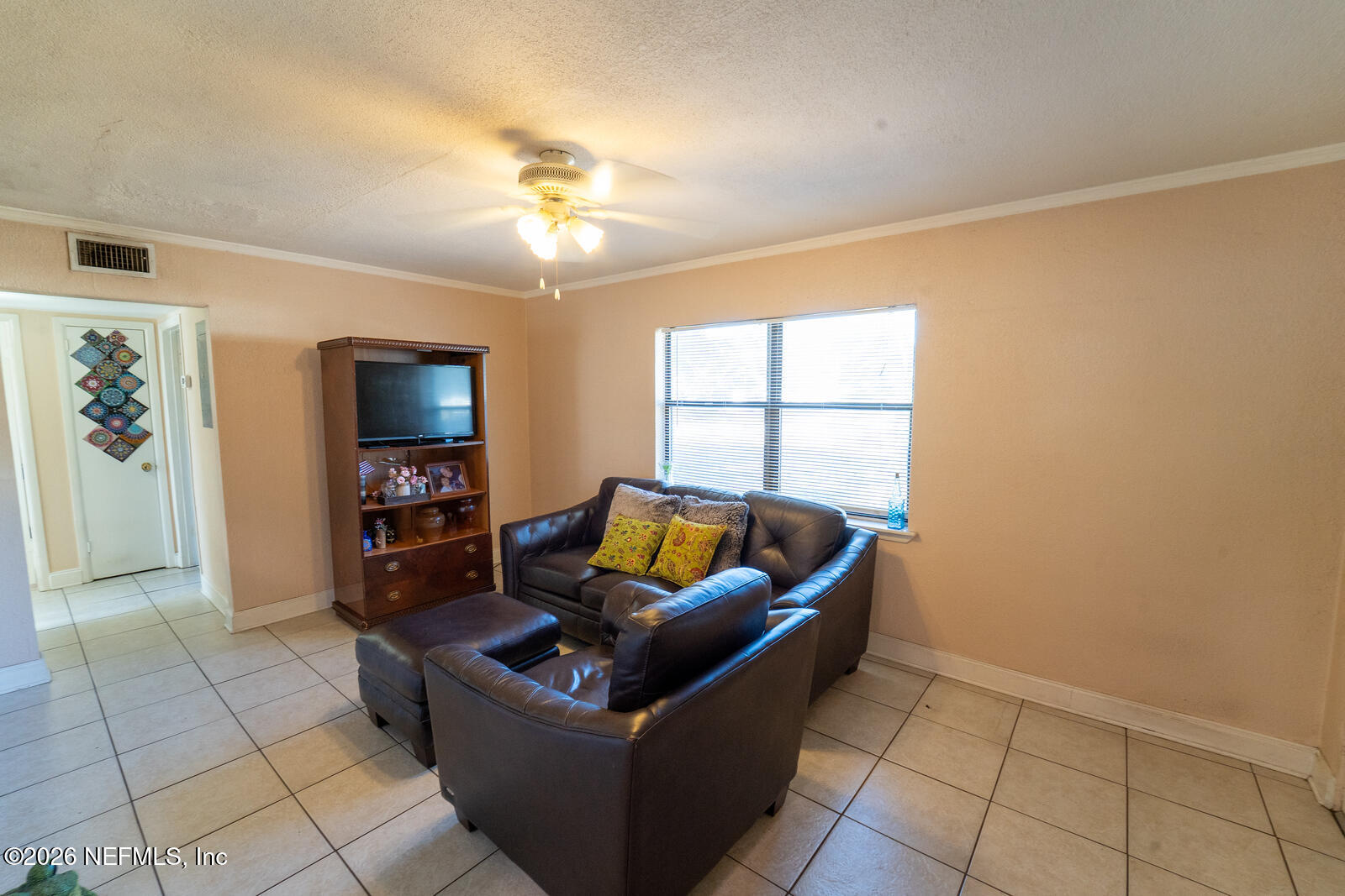 5308 North River Road Jacksonville, FL 32211 - Photo 5 of 25 a living room with furniture and a flat screen tv