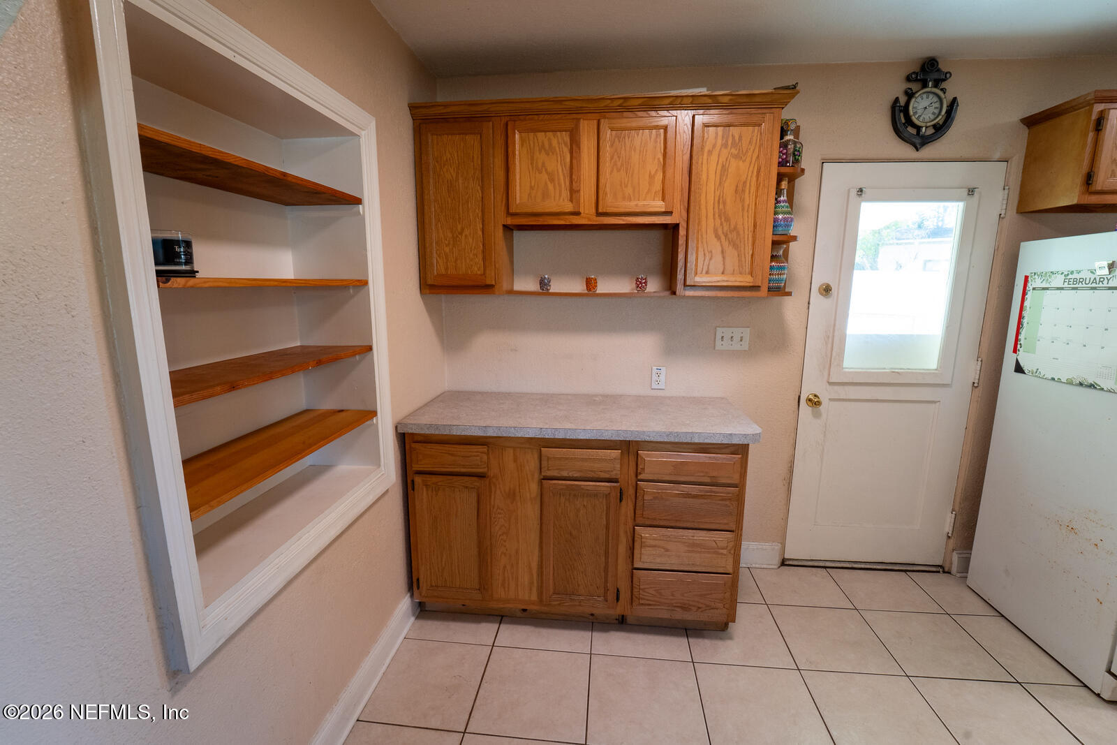 5308 North River Road Jacksonville, FL 32211 - Photo 8 of 25 a kitchen with a cabinets and a stove top oven