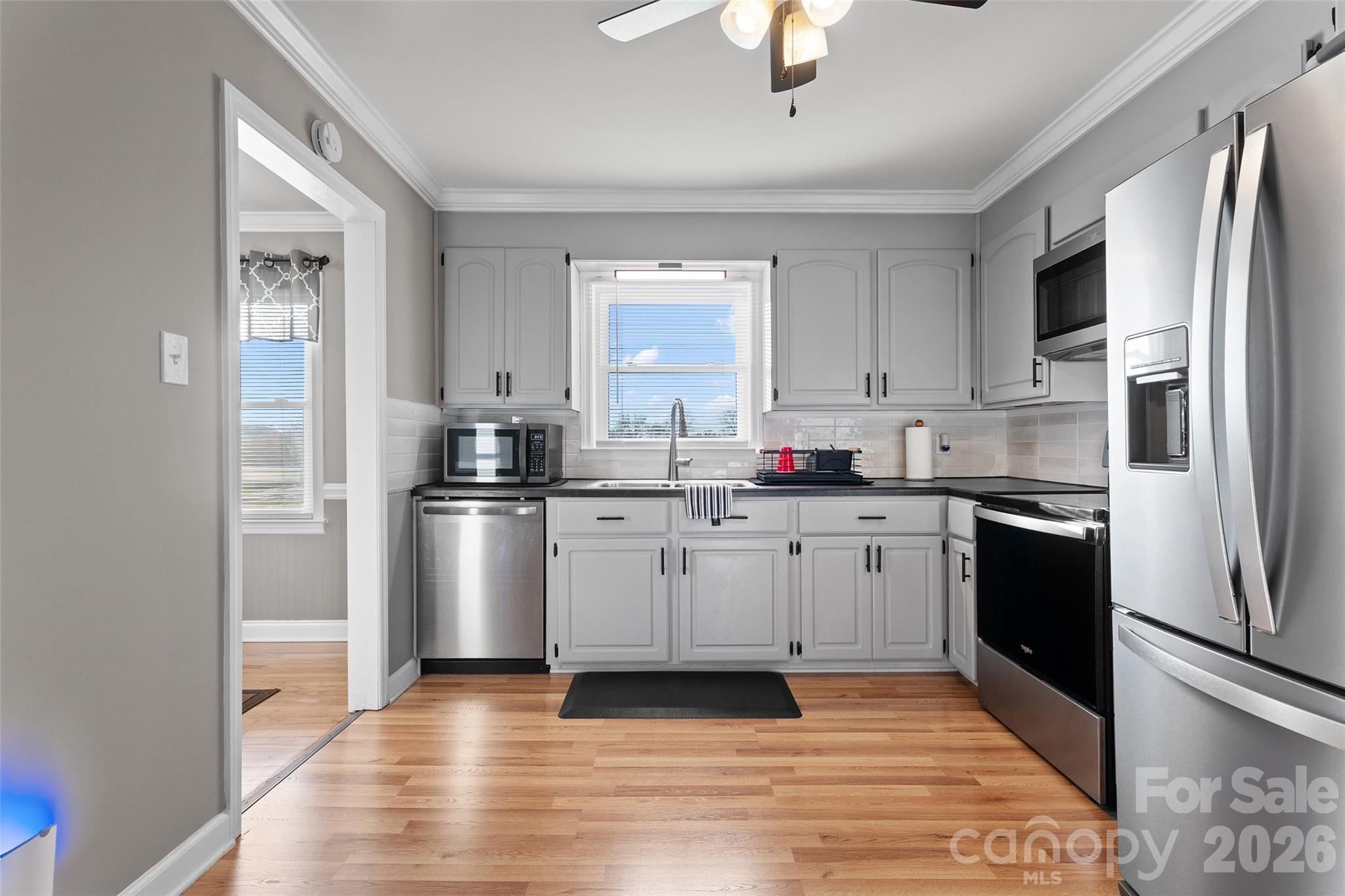 871 Saluda Road Chester, SC 29706 - Photo 14 of 46 a kitchen with granite countertop white cabinets and stainless steel appliances