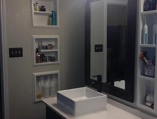 a bathroom with a sink and a mirror