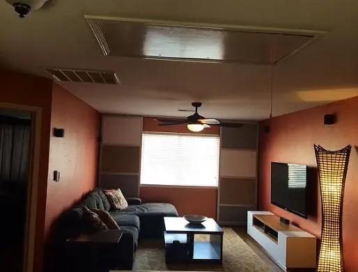 a living room with furniture and a flat screen tv