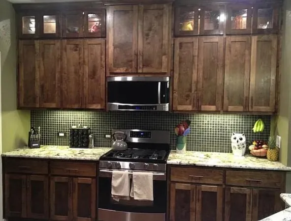 a kitchen with granite countertop a refrigerator a stove and a sink