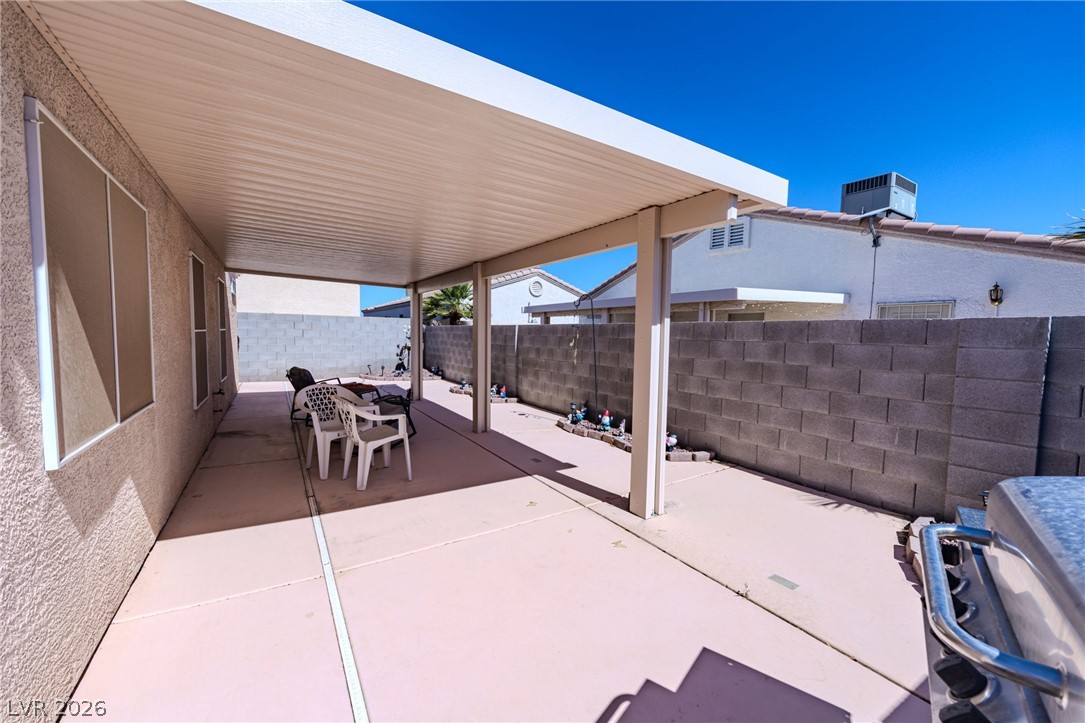 4994 Mascaro Drive Las Vegas, NV 89122 - Photo 23 of 30 A spacious covered patio provides a delightful outdoor living space.