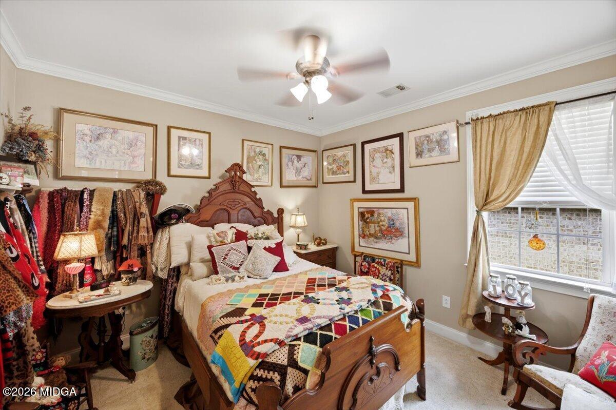 210 Oberon Place Macon, GA 31210 - Photo 21 of 31 a bedroom with a bed and a chandelier