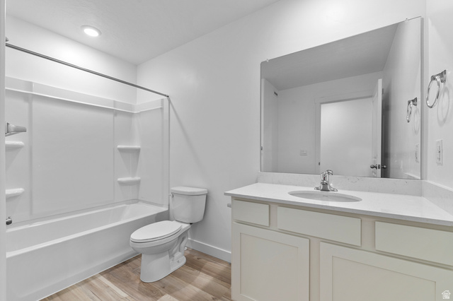 2829 North 710 West, Unit 15 Logan, UT 84321 - Photo 20 of 23 Modern bathroom featuring a single vanity with a solid surface countertop, an undermount sink, and a large mirror