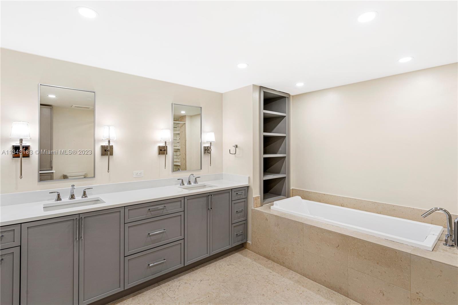 495 Brickell Avenue, Unit 3804 Miami, FL 33131 - Photo 11 of 23 a bathroom with a tub sink and mirror