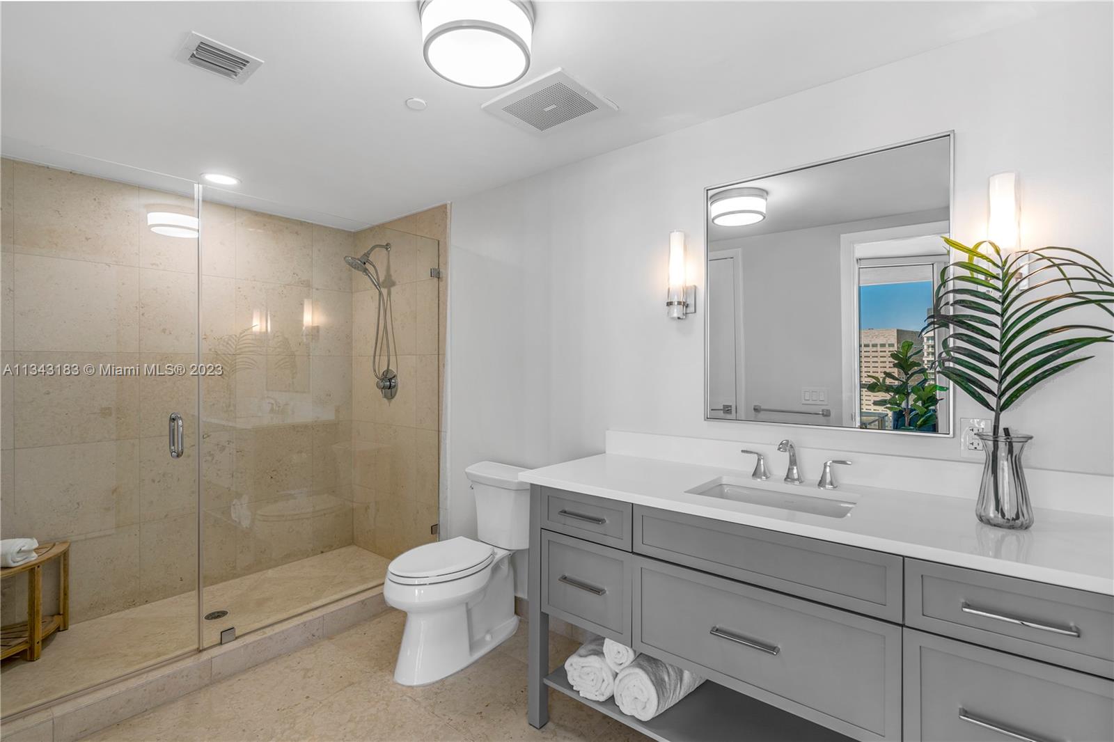 495 Brickell Avenue, Unit 3804 Miami, FL 33131 - Photo 14 of 23 a bathroom with a sink a toilet and shower