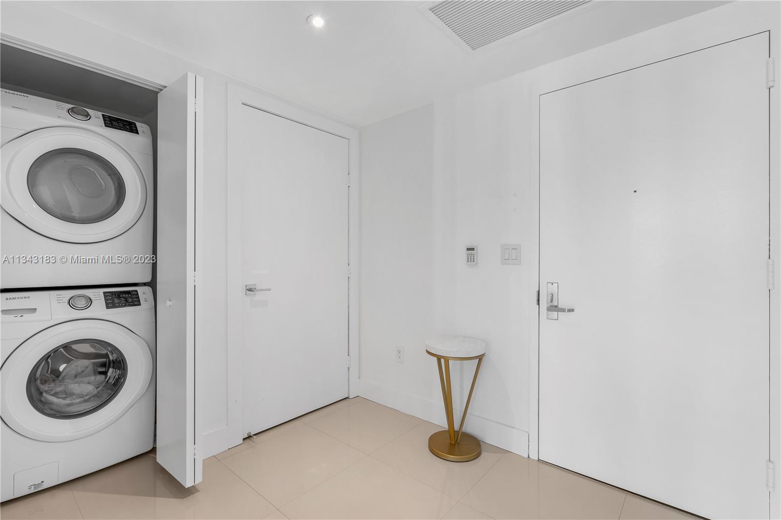 495 Brickell Avenue, Unit 3804 Miami, FL 33131 - Photo 15 of 23 a view of a storage & utility room with washer and dryer