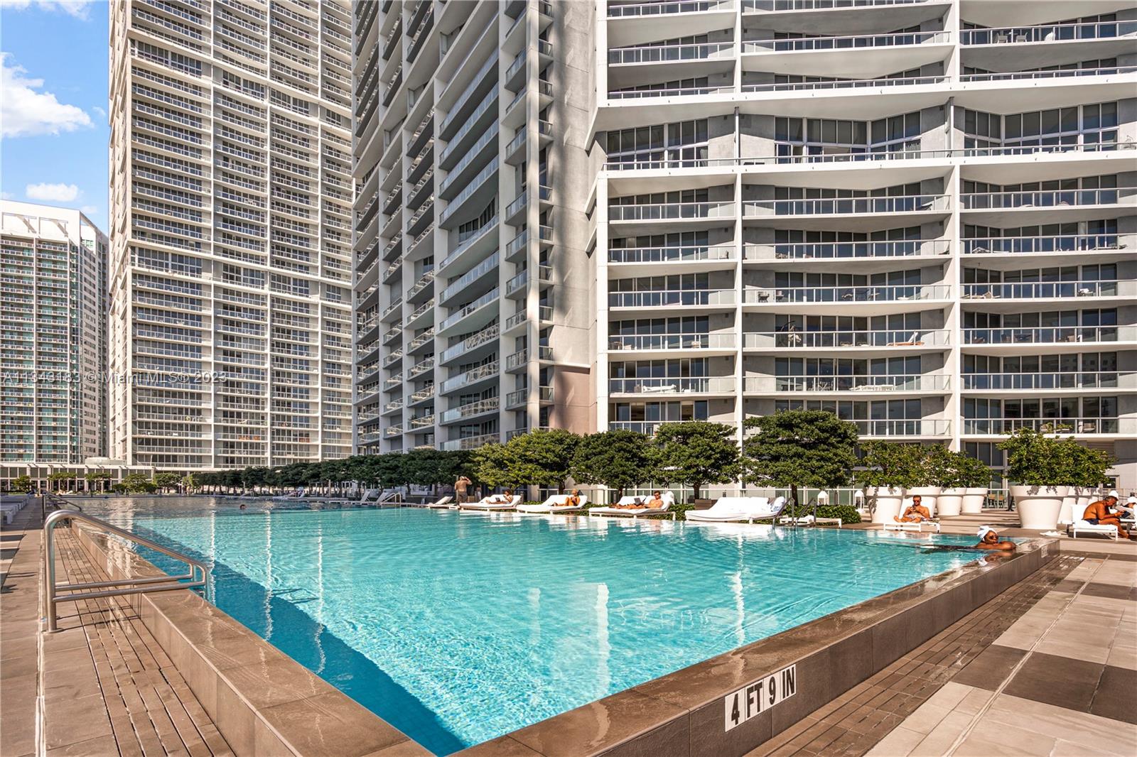 495 Brickell Avenue, Unit 3804 Miami, FL 33131 - Photo 17 of 23 a front view of a residential apartment building with swimming pool and outdoor space