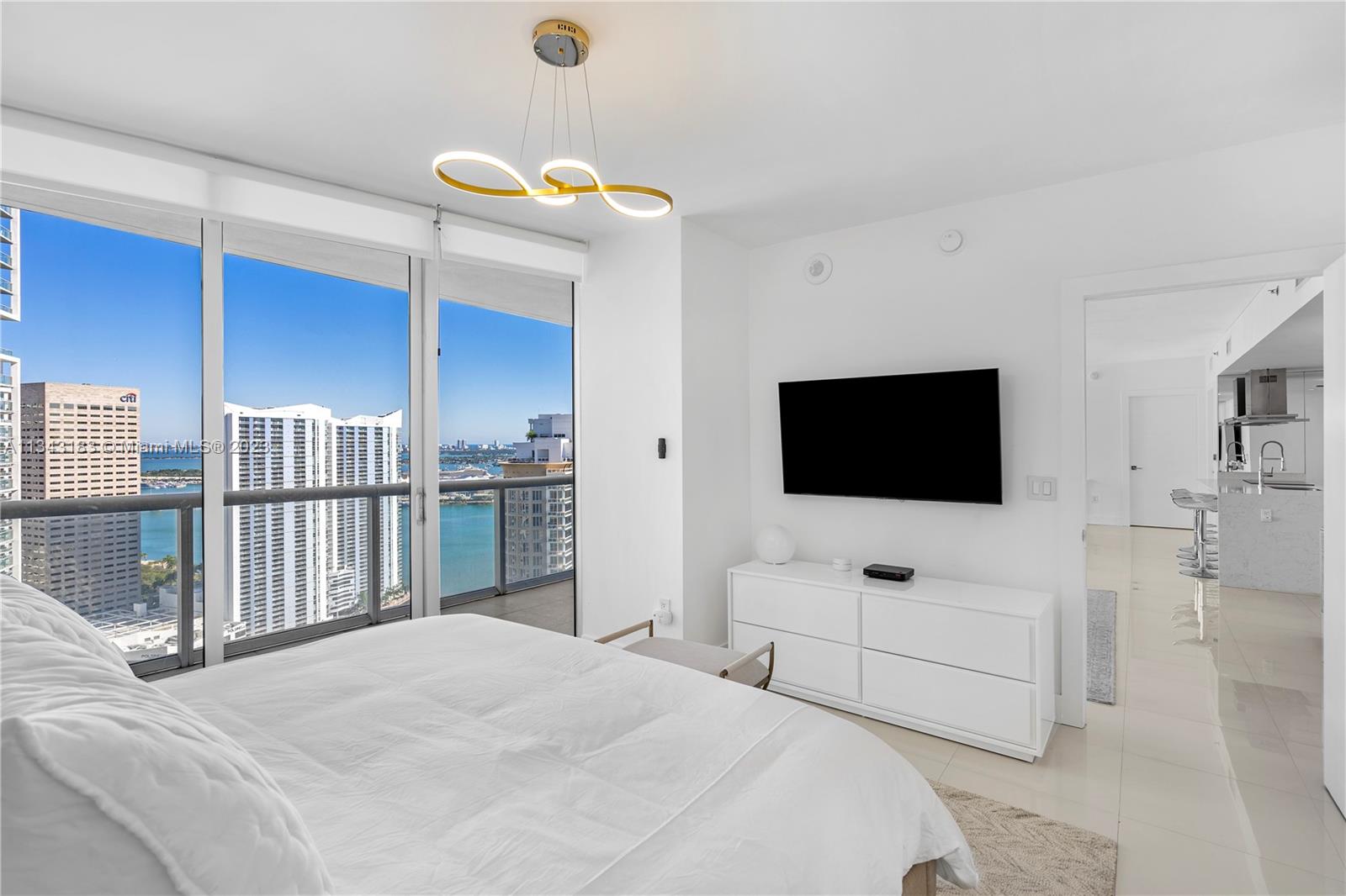 495 Brickell Avenue, Unit 3804 Miami, FL 33131 - Photo 8 of 23 a bedroom with a bed and a flat screen tv