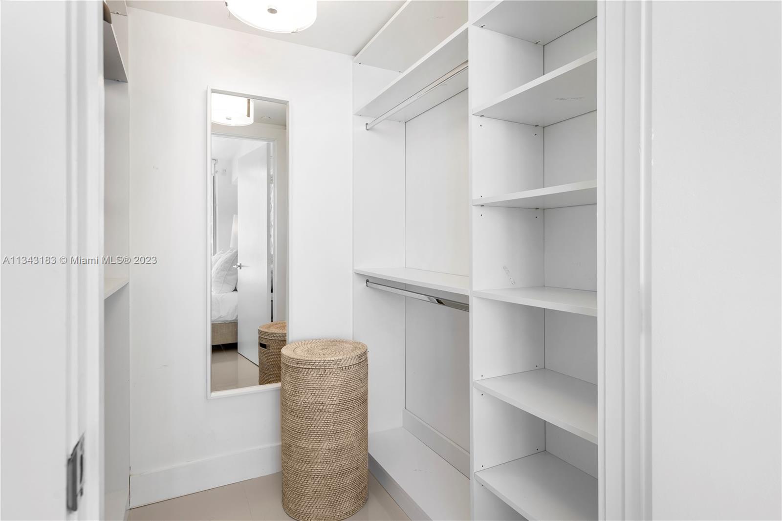 495 Brickell Avenue, Unit 3804 Miami, FL 33131 - Photo 9 of 23 a view of walk in closet with empty racks