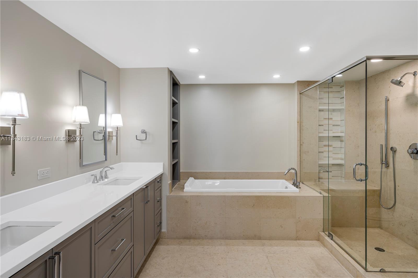 495 Brickell Avenue, Unit 3804 Miami, FL 33131 - Photo 10 of 23 a bathroom with a bathtub shower sink and toilet