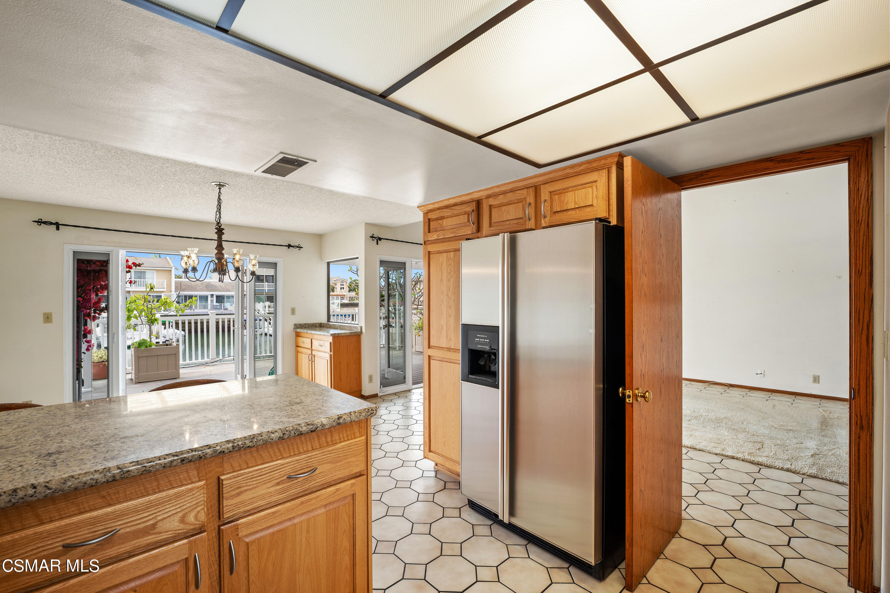 4512 Falkirk Bay Oxnard, CA 93035 - Photo 16 of 40 a kitchen with stainless steel appliances granite countertop a refrigerator and a sink