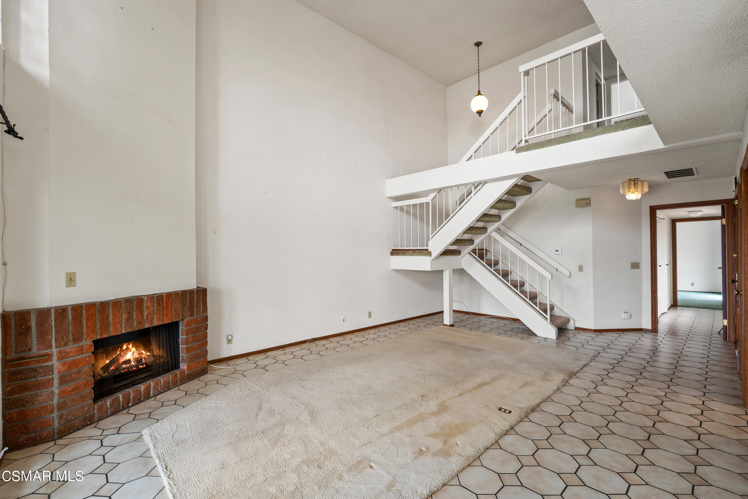 4512 Falkirk Bay Oxnard, CA 93035 - Photo 10 of 40 a view of an empty room with stairs and wooden floor