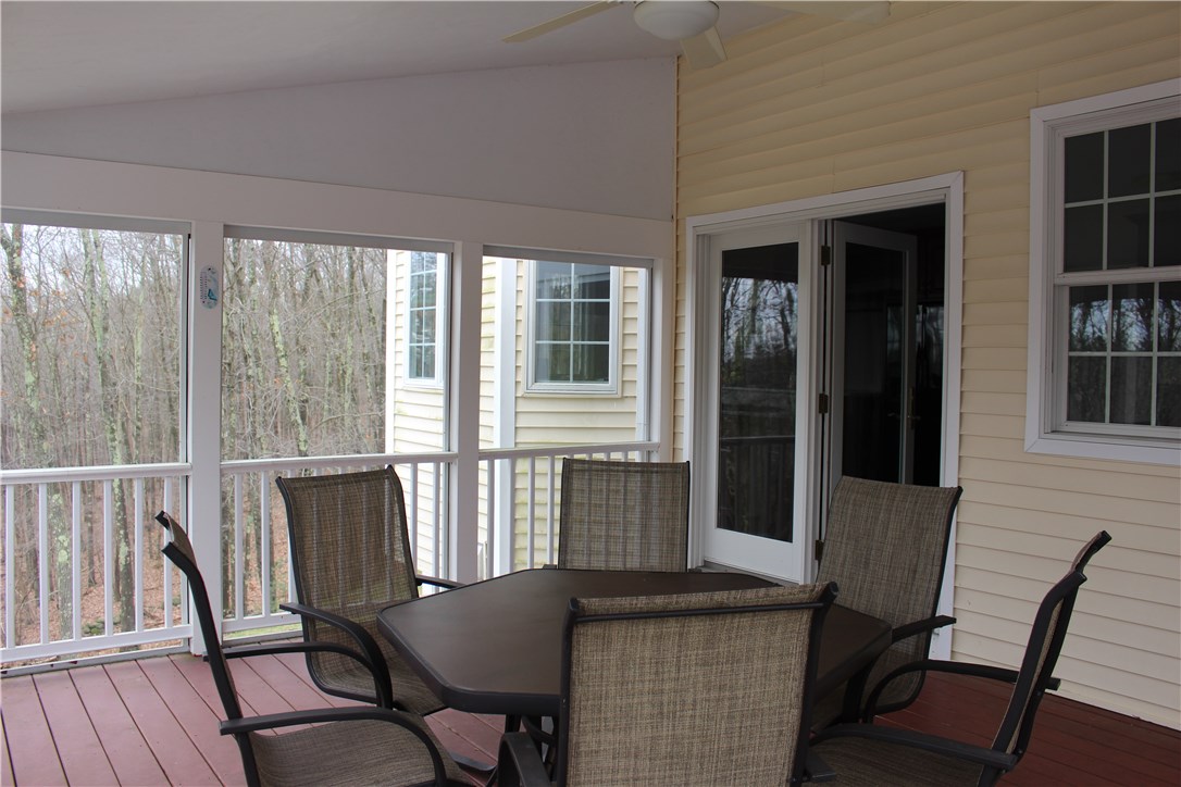 161 Chocolog Road Uxbridge, MA 01569 - Photo 26 of 37 Enclosed deck just off the kitchen and overlooking the salt water pool is great for entertaining.