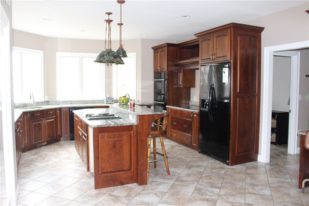 161 Chocolog Road Uxbridge, MA 01569 - Photo 6 of 37 Chef's kitchen boasts 2 stove tops, wall oven and microwave and prep sink.