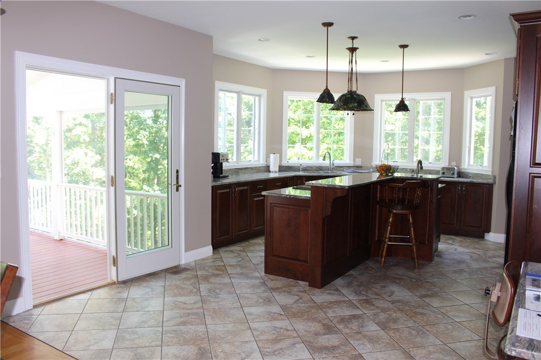 161 Chocolog Road Uxbridge, MA 01569 - Photo 7 of 37 Open concept kitchen that leads to the enclosed deck. Perfect for entertaining.