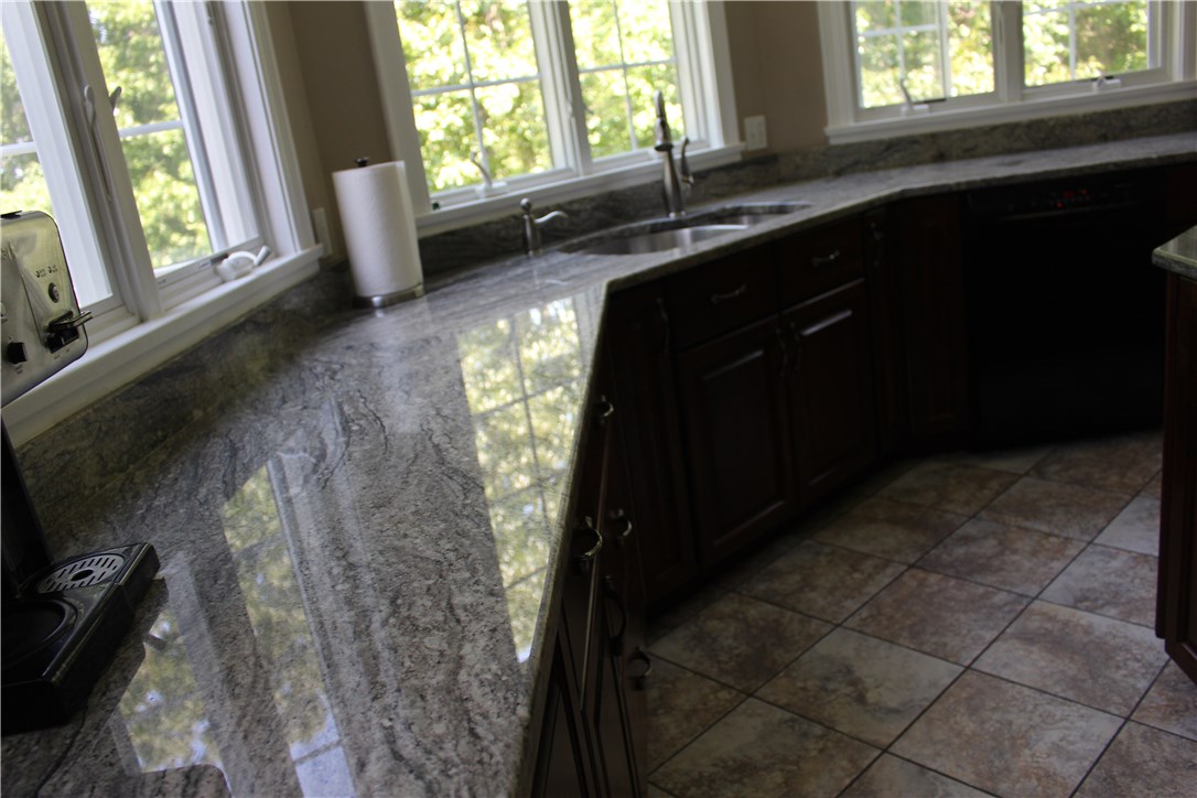 161 Chocolog Road Uxbridge, MA 01569 - Photo 8 of 37 Beautiful granite counter tops offer lots of space for meal prep and baking.
