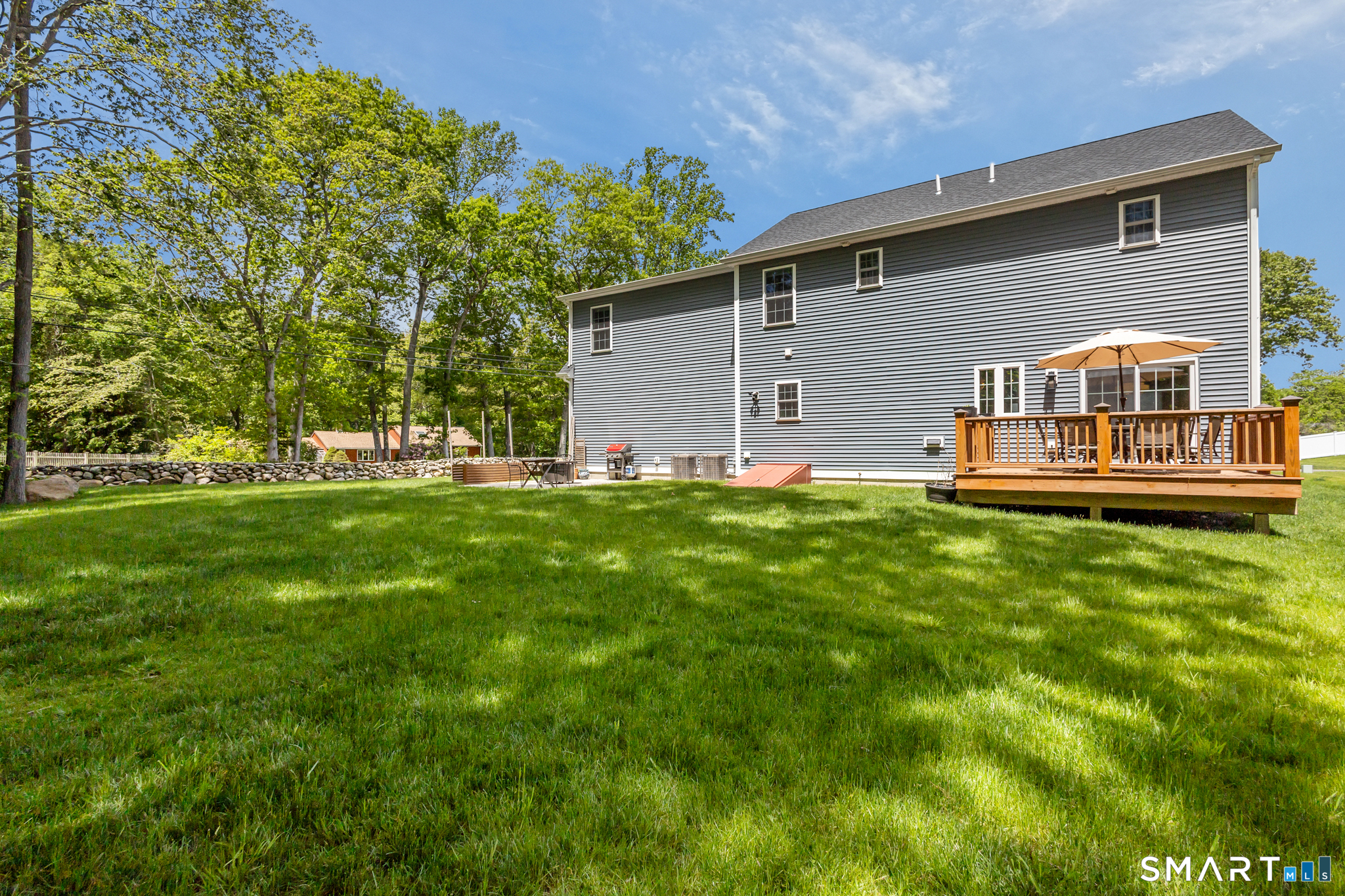2 Martys Way Gales Ferry, CT 06335 - Photo 33 of 40 a front view of house with yard and seating area