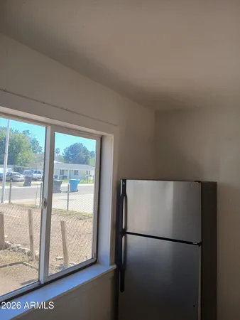 a white refrigerator freezer and a window