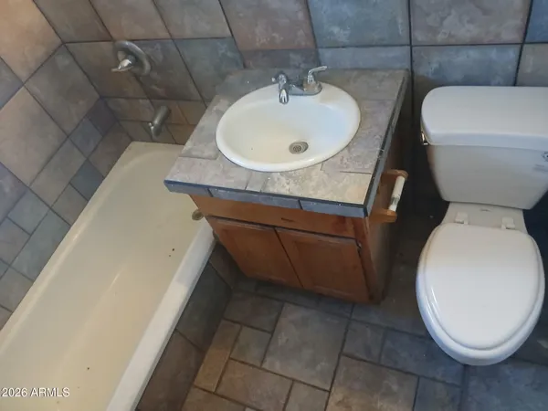 a bathroom with a sink and a toilet
