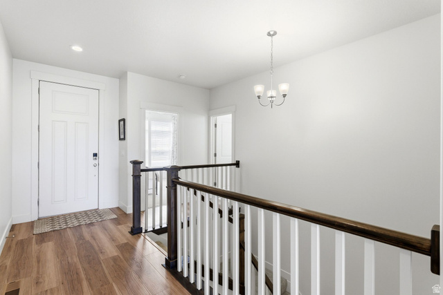 108 West Monte Rosa Lane Midway, UT 84049 - Photo 23 of 48 Entryway featuring wood-finish flooring, white paneled door, and recessed lighting
