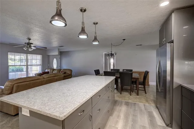 a kitchen with a table and chairs