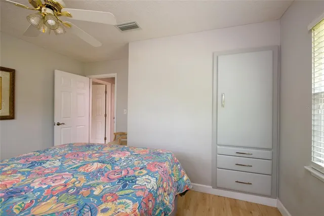 a bedroom with a bed and a dresser