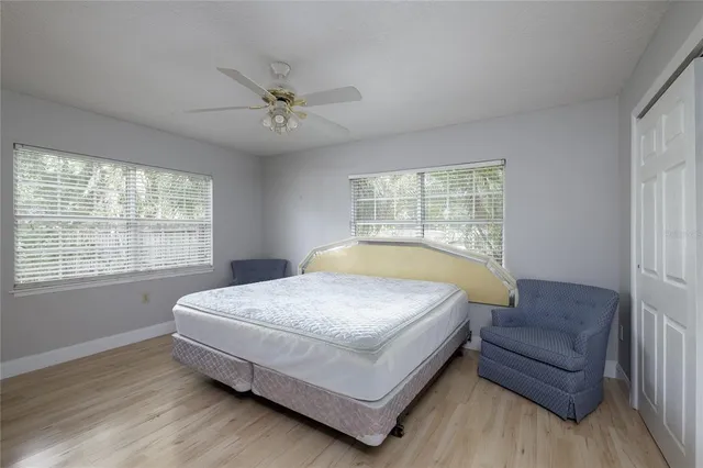 a bedroom with a bed and a couch