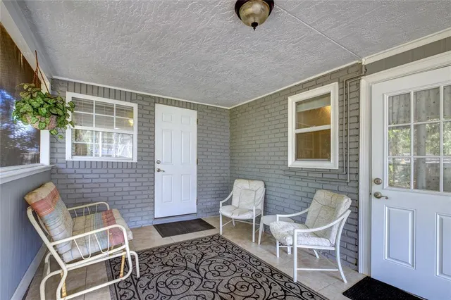 a front view of a house with outdoor seating