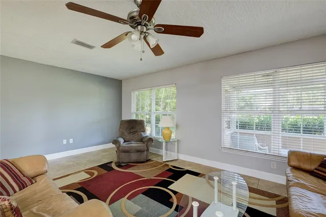a living room with furniture and a window