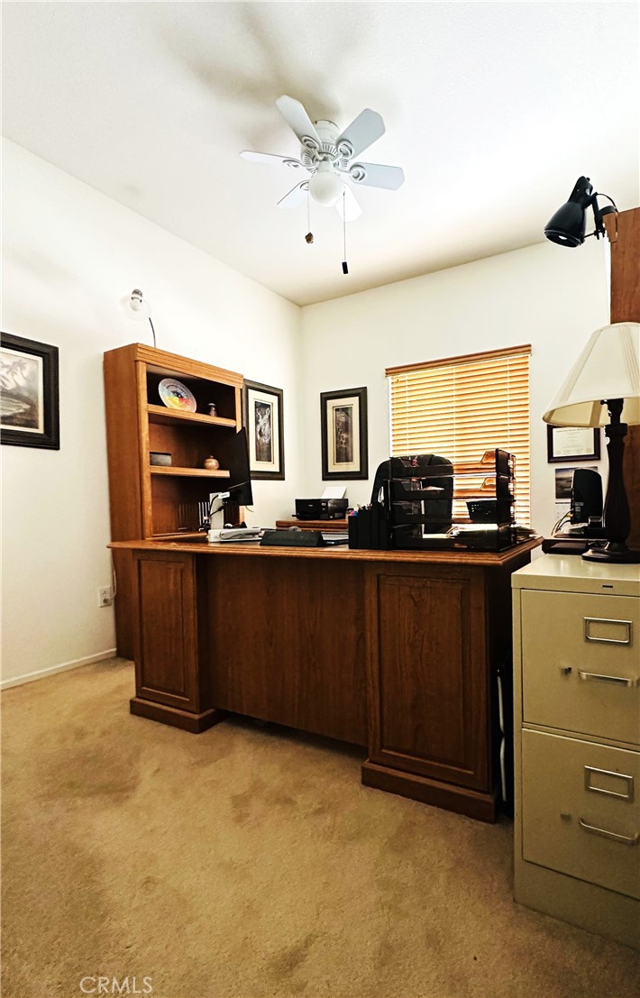 1665 Ravenswood Road Beaumont, CA 92223 - Photo 20 of 41 a kitchen with cabinets a sink and stainless steel appliances
