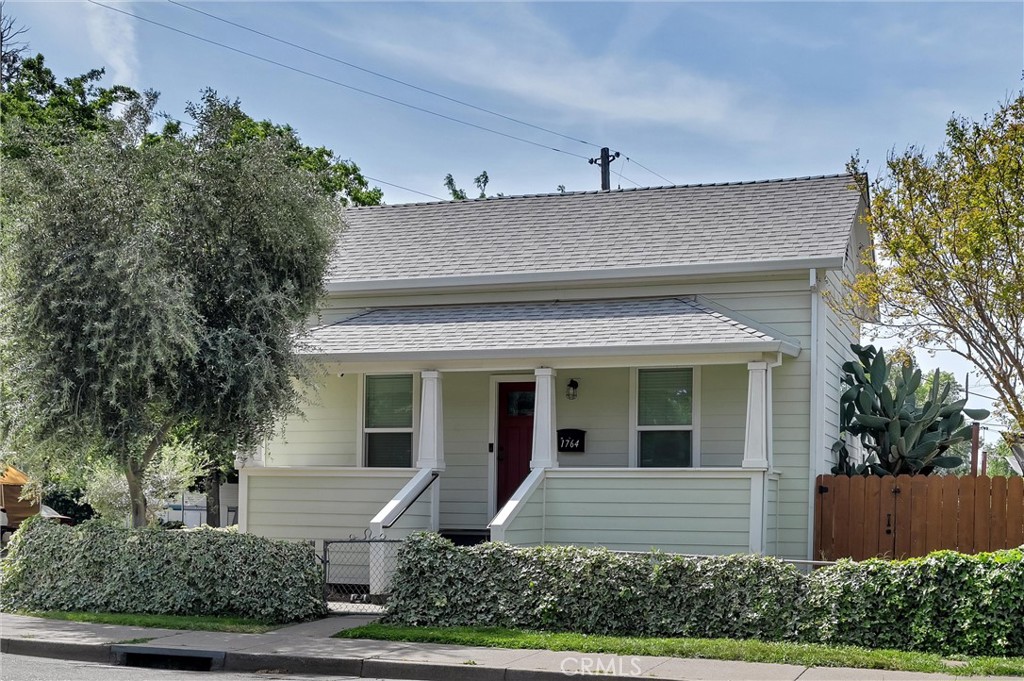 front view of house with potted plants