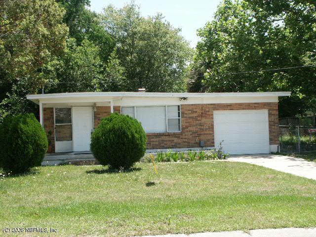 451 Skate Road Atlantic Beach, FL 32233 - Photo 1 of 1 a view of a house with a yard and a large tree
