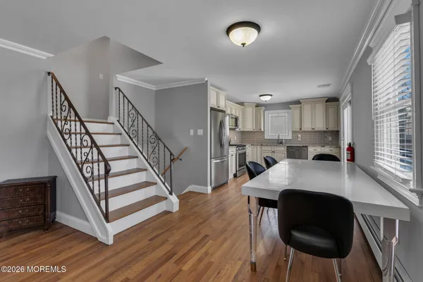 a view of kitchen island with furniture and wooden floor