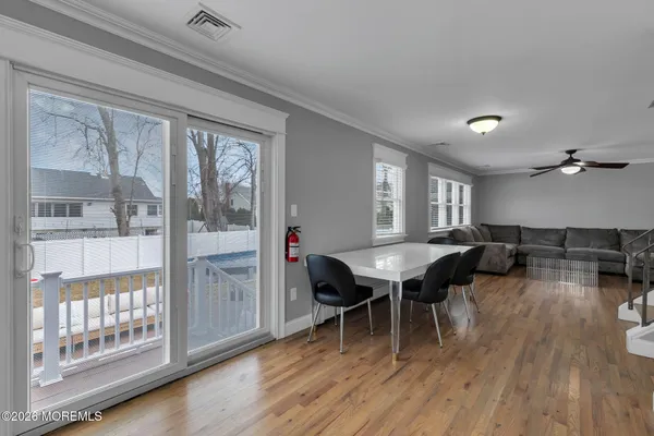 a workspace with furniture window and wooden floor