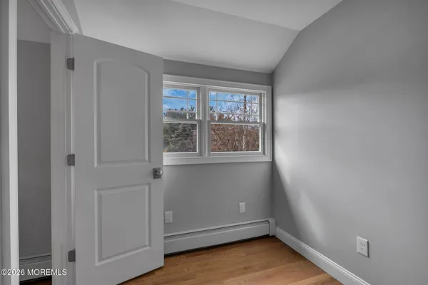 wooden floor and window in an empty room