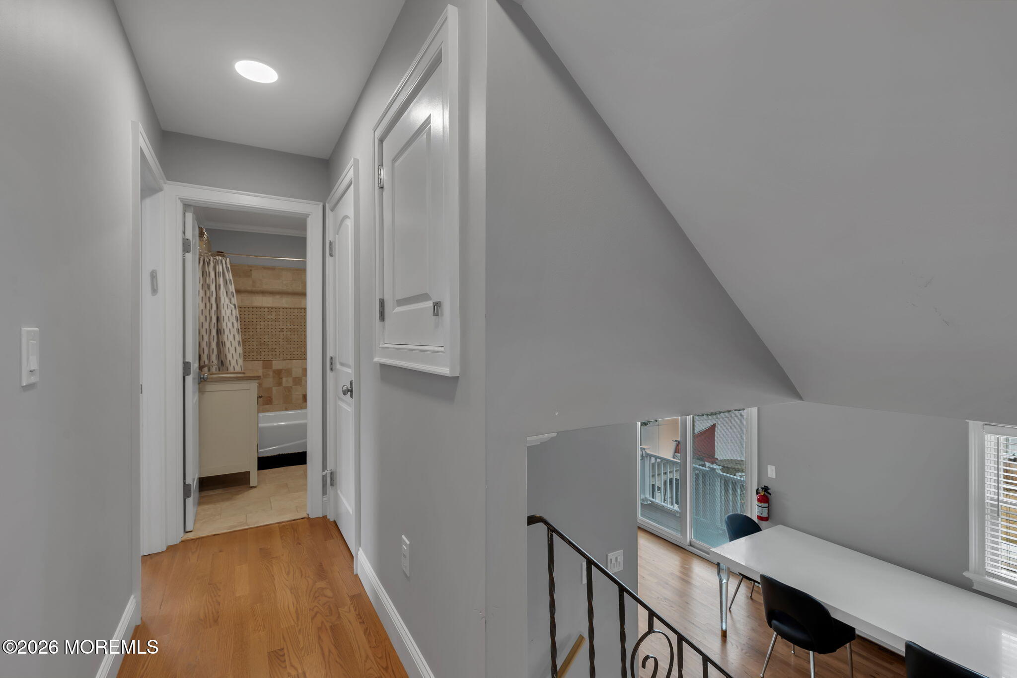 27 Branch Road Oakhurst, NJ 07755 - Photo 29 of 44 a view of a hallway with bathroom and wooden floor