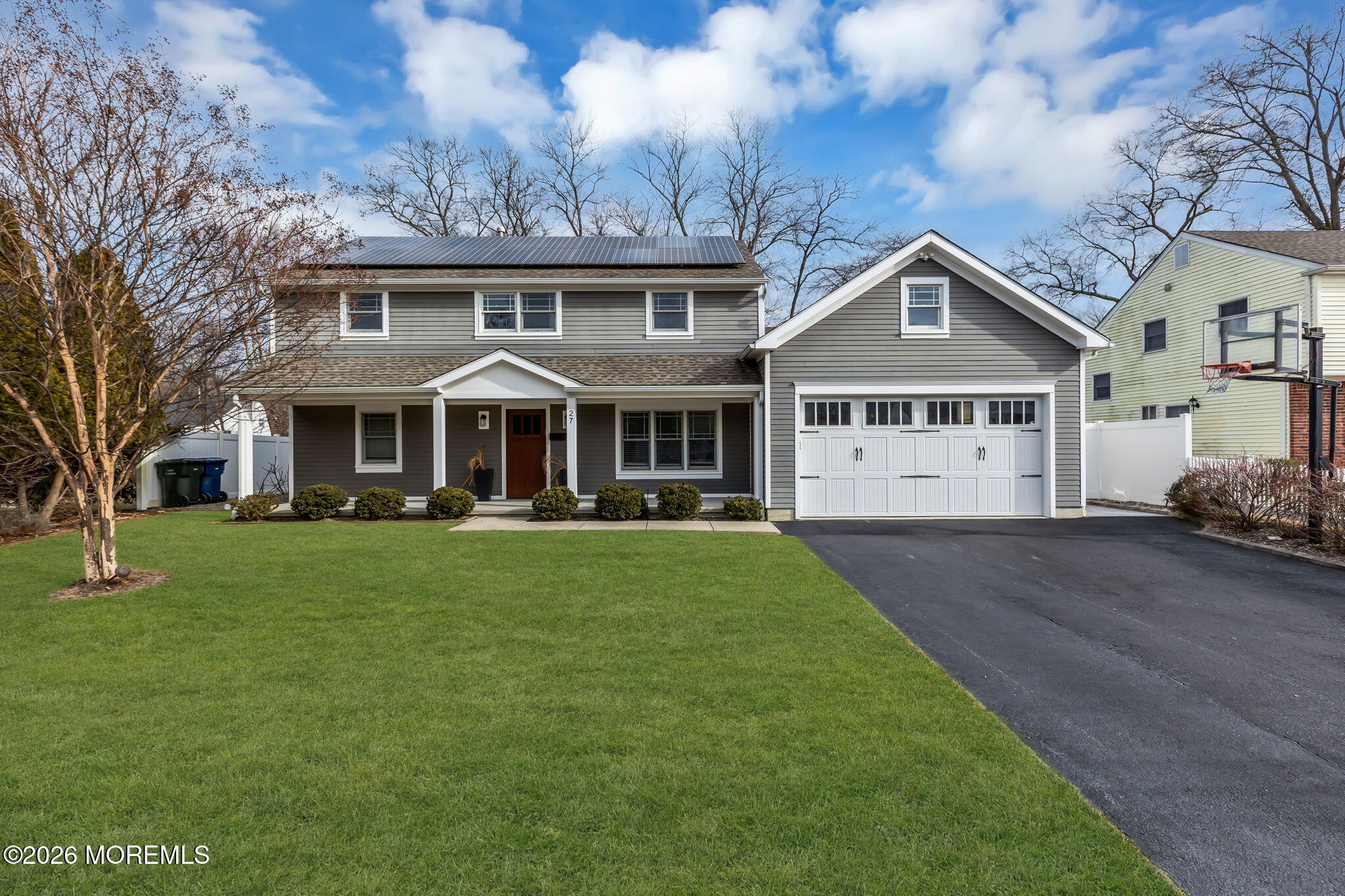 27 Branch Road Oakhurst, NJ 07755 - Photo 3 of 44 a front view of a house with a yard