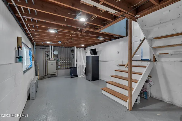 a view of an empty room with stairs