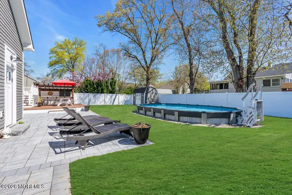 a view of a house with a yard porch and sitting area