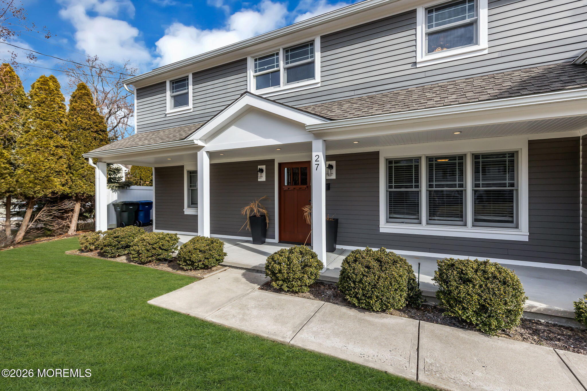 27 Branch Road Oakhurst, NJ 07755 - Photo 5 of 44 a front view of a house with a yard