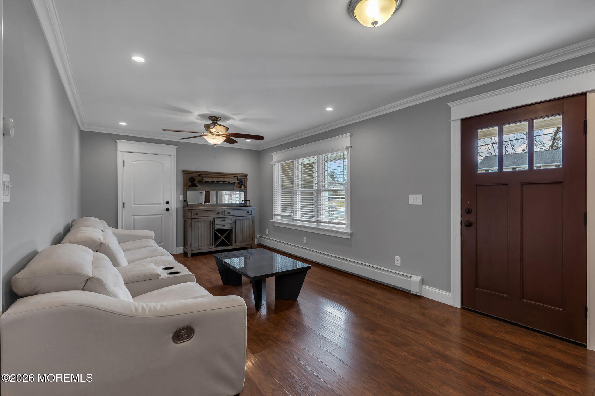 27 Branch Road Oakhurst, NJ 07755 - Photo 9 of 44 a living room with furniture and wooden floor